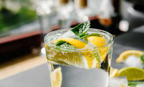 Refreshing iced infused water with lime, lemon and mint. summer drink, cocktail concept.