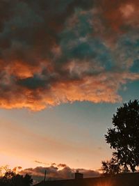 Low angle view of silhouette trees against sky during sunset