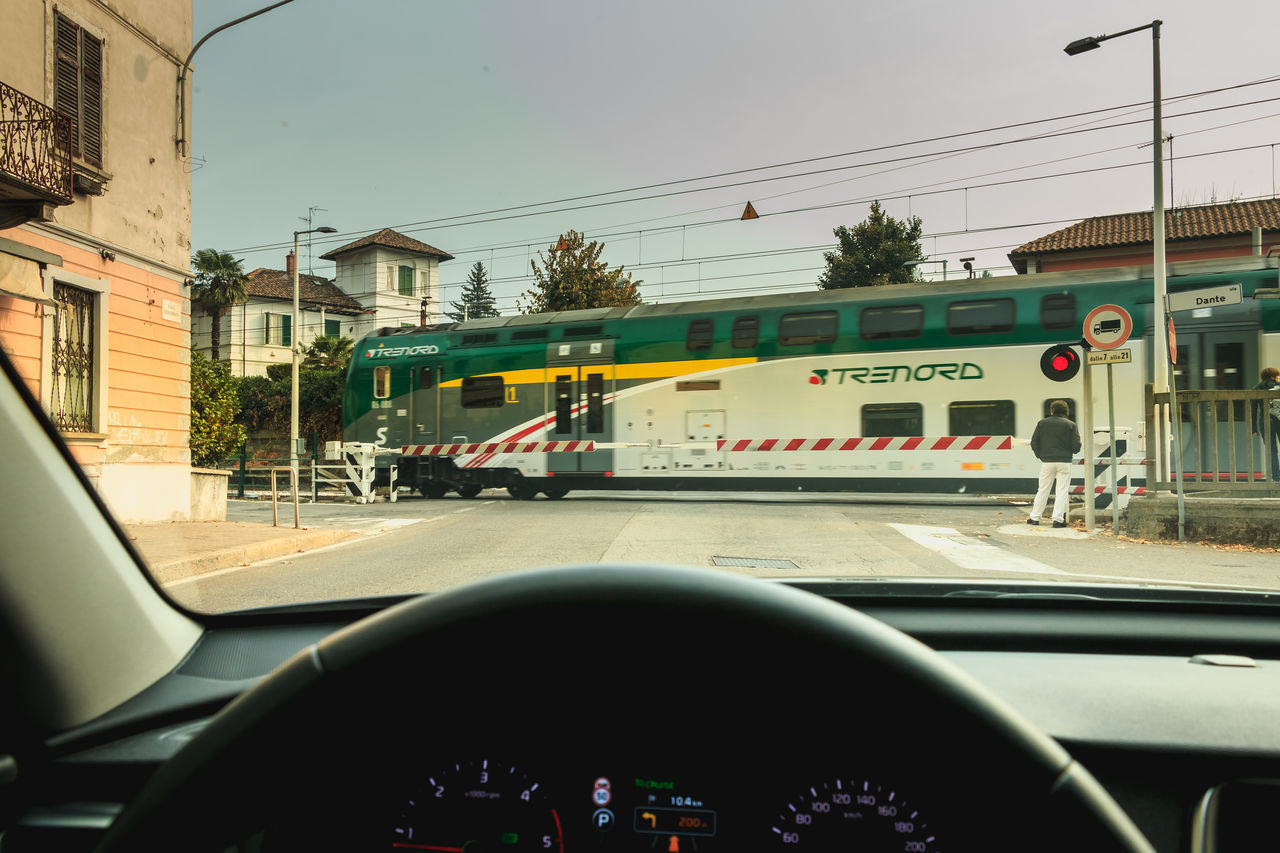 VIEW OF CARS ON ROAD SEEN THROUGH CAR WINDSHIELD