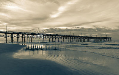 Pier over sea against sky