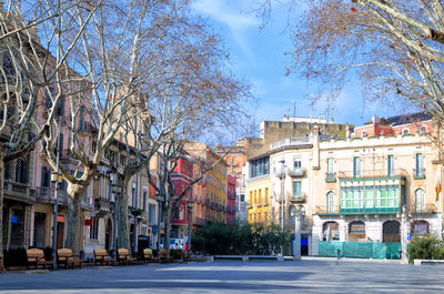 Street by buildings in city 