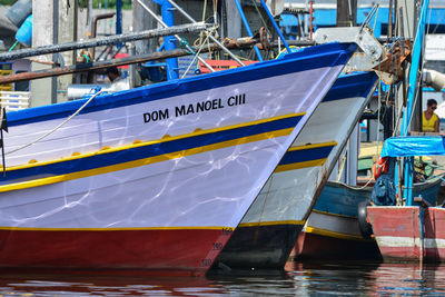 Boats moored at harbor