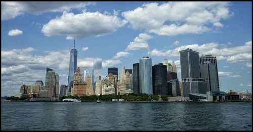 City skyline against cloudy sky