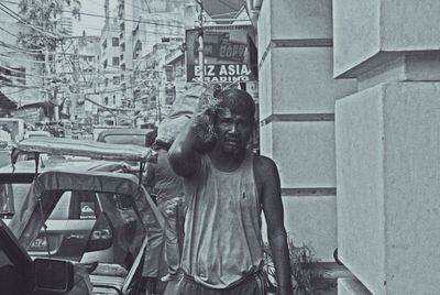 Statue of man standing by sculpture