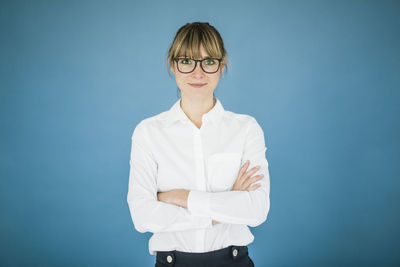 Portrait of smiling businesswoman with glasses