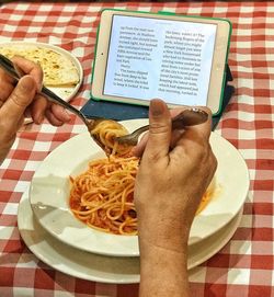 Midsection of man holding food on table