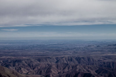 Aerial view of dramatic landscape against sky