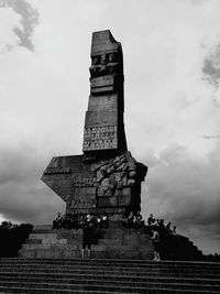 Low angle view of historical building against cloudy sky