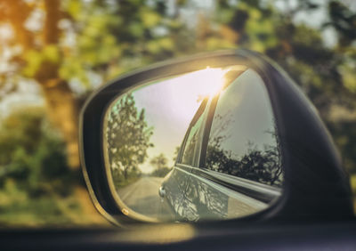 Reflection of car on side-view mirror