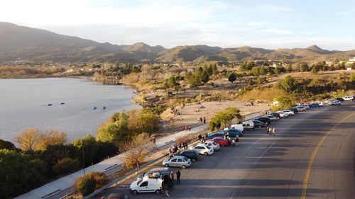 High angle view of cars on road against sky