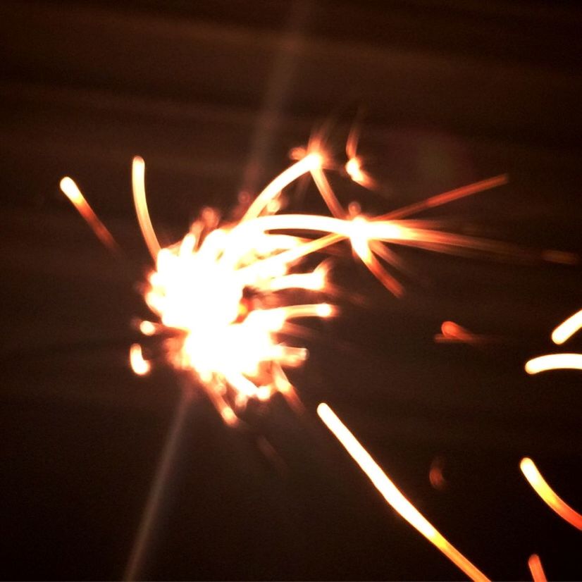 CLOSE-UP OF ILLUMINATED FIREWORK DISPLAY