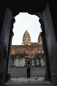 Woman standing in front of historical building