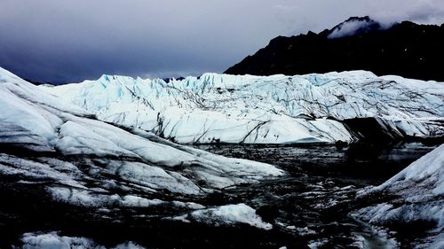 Scenic view of snow covered mountains