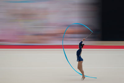 Low section of woman playing soccer