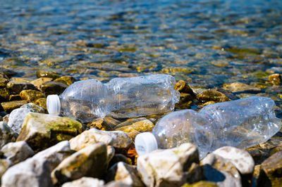 Plastic bottles abandoned on a beach. water pollution, microplastics, waste.