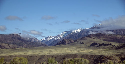 Scenic view of snowcapped mountains against sky