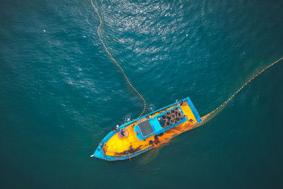 High angle view of sailboat in sea