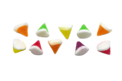 Close-up of candies against white background