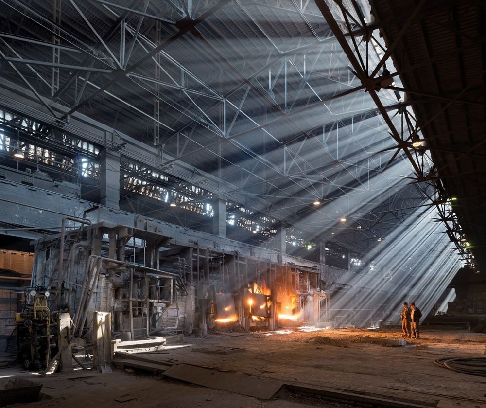 industry, architecture, working, fire, factory, illuminated, real people, heat - temperature, indoors, fire - natural phenomenon, built structure, standing, men, burning, people, group of people, occupation, nature, lighting equipment, metal, industrial equipment, manufacturing equipment, metal industry, ceiling