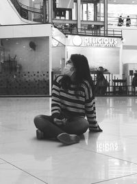 Women sitting on tiled floor