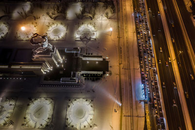 Digital composite image of illuminated lighting equipment in city