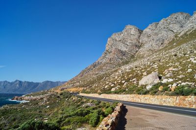 Scenic view of mountains against clear blue sky