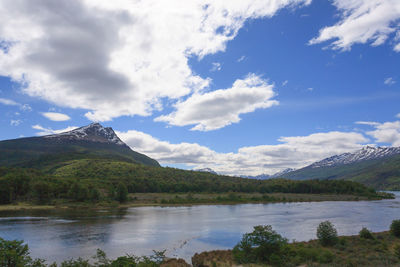 Scenic view of lake and mountains against sky