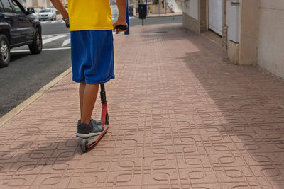 Rear view of man walking on street