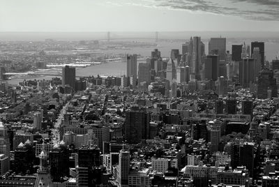 High angle view of modern buildings in city against sky