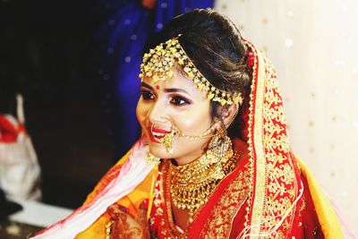 Portrait of a beautiful young lady with ornaments