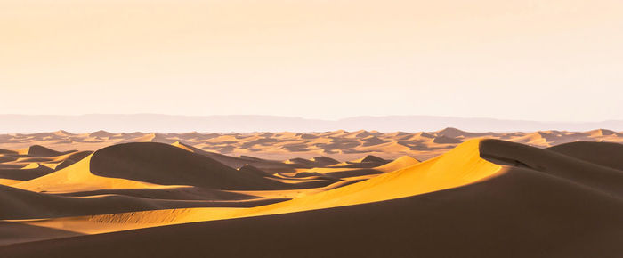 Scenic view of desert against clear sky