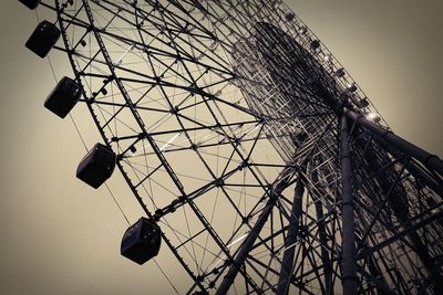 Low angle view of ferris wheel against sky