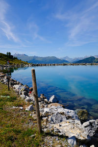 Scenic view of lake against blue sky