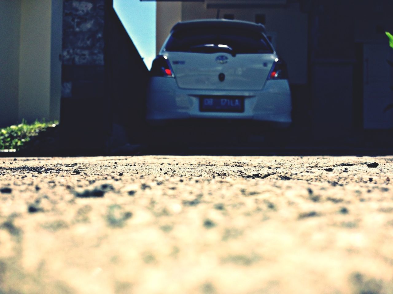 transportation, surface level, mode of transport, car, street, road, road marking, land vehicle, asphalt, selective focus, built structure, building exterior, architecture, the way forward, day, travel, no people, city, outdoors, window