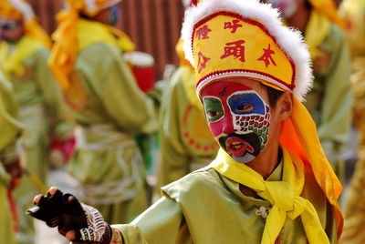 Close-up of boy wearing carnival costume