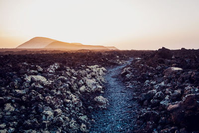 Scenic view of landscape against sky during sunset