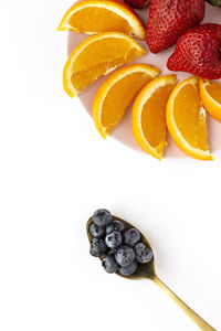 High angle view of oranges against white background