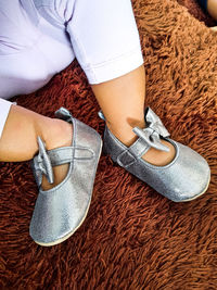 Low section of woman sitting on floor