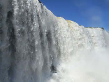 Close-up of waterfall against sky