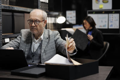 Young man using laptop at office