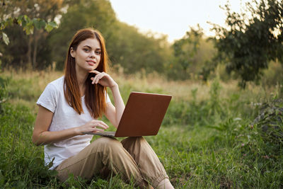 Young woman using digital tablet