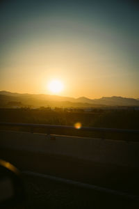 Scenic view of landscape against sky during sunset