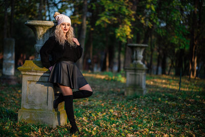 Full length of young woman during autumn