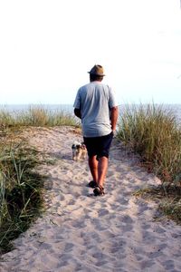 Rear view of woman standing in water