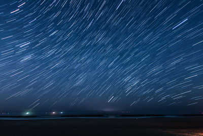 Scenic view of sea against sky at night