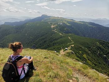 Rear view of woman looking at mountains