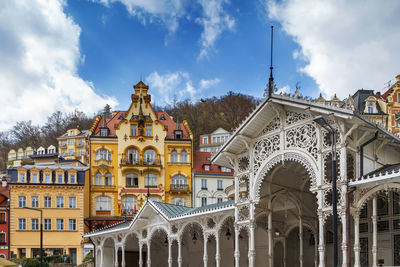 Panoramic view of buildings in city against sky