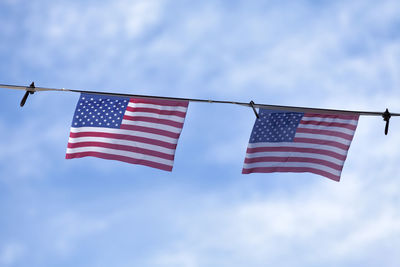 Low angle view of flag against sky