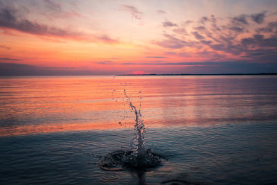 Scenic view of sea against sky at sunset