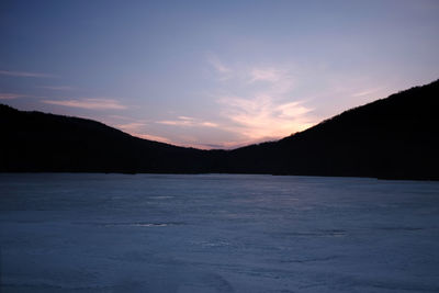 Scenic view of mountains against sky during sunset